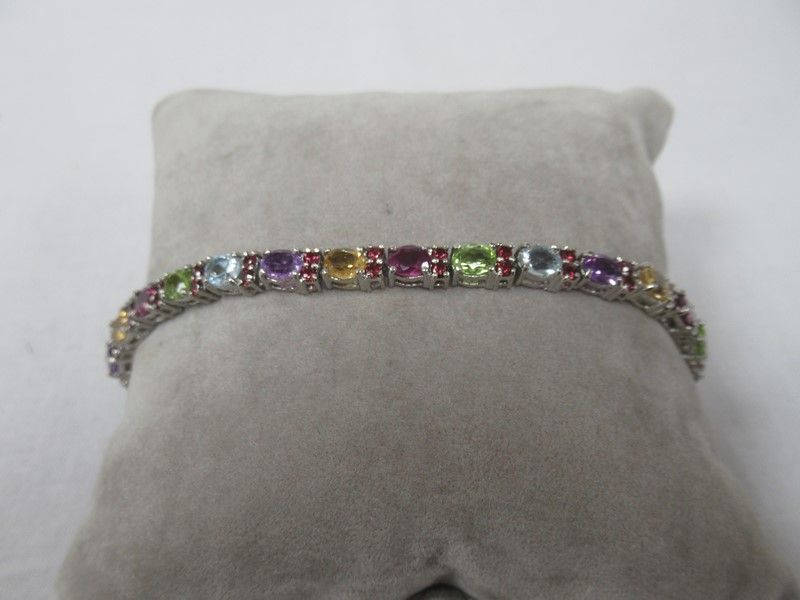Null Silver bracelet set with amethysts, citrines, peridots and topazes. Open le&hellip;