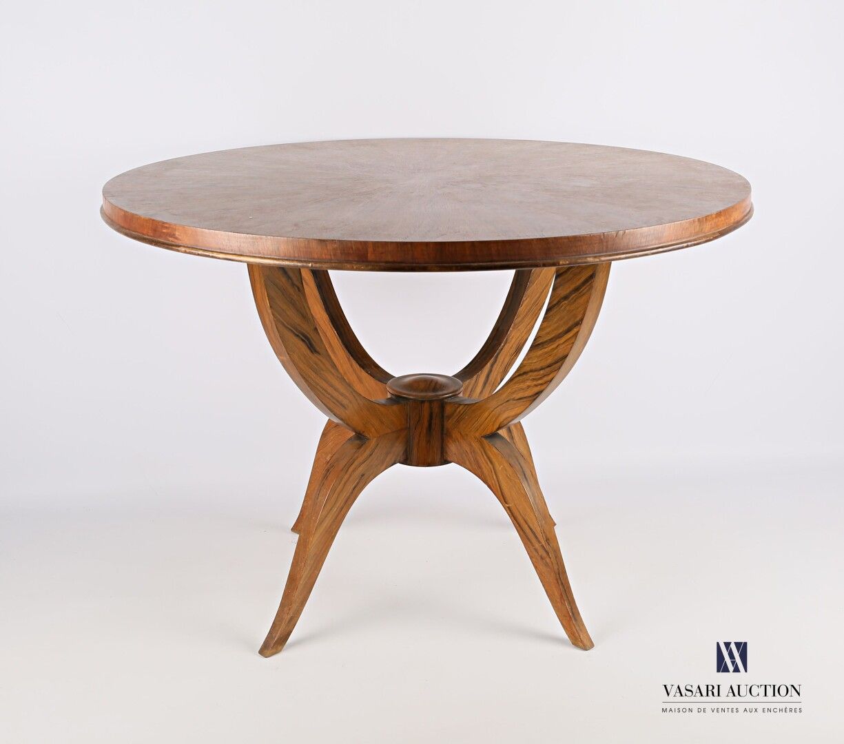 Null Veneer pedestal table, the round top rests on four arched uprights joined b&hellip;