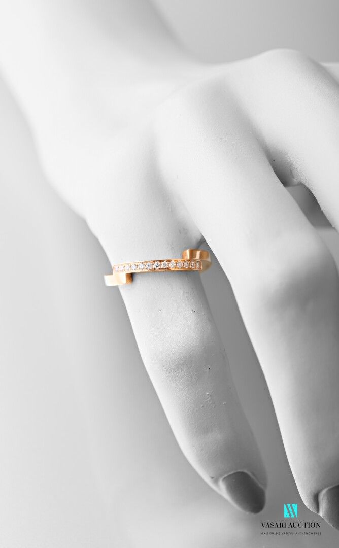 Null Ring in pink gold 750 thousandths formed of four parts, one paved with 13 d&hellip;