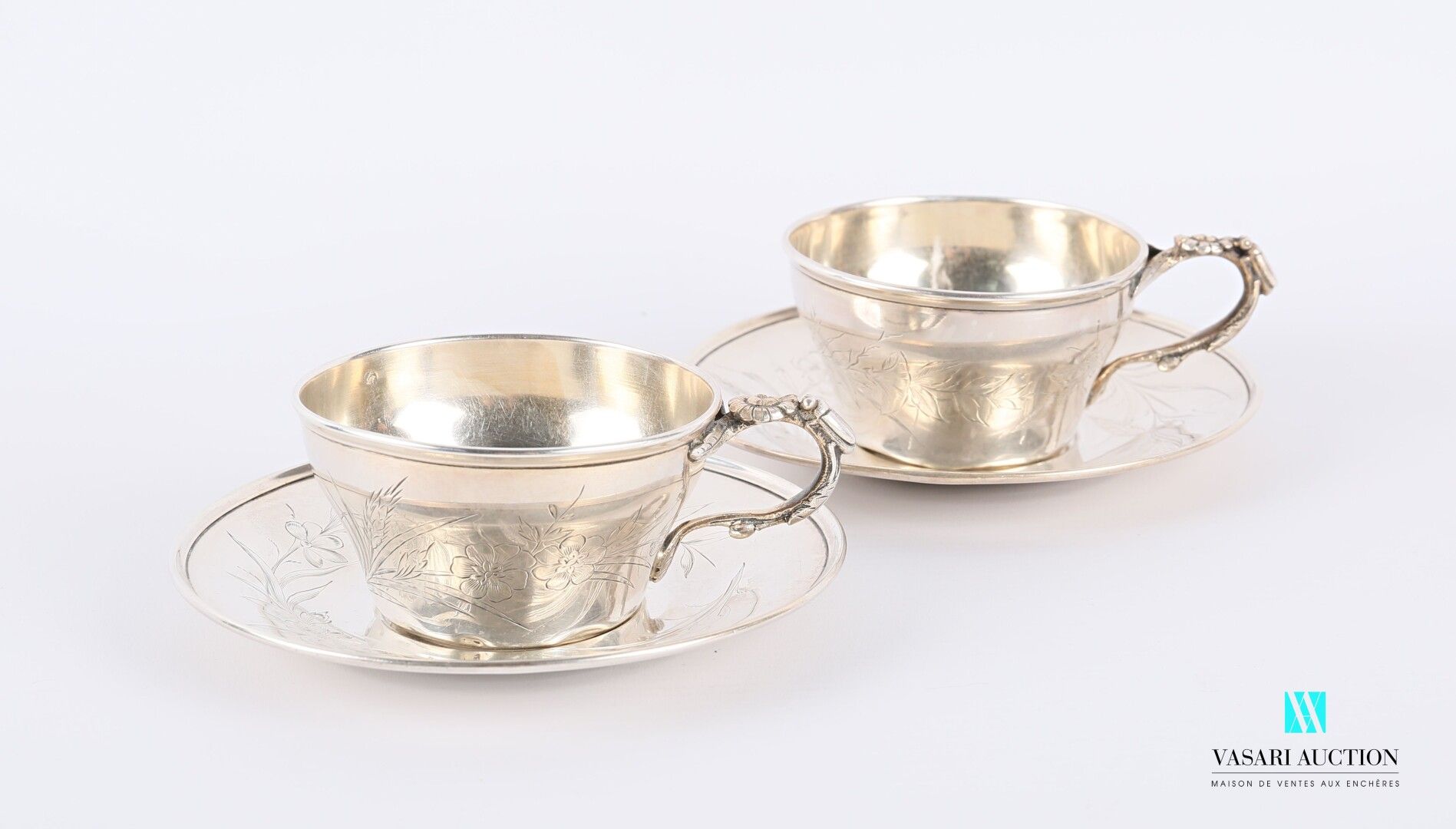Null Two silver cups and their saucers, one decorated with a reserve figure betw&hellip;