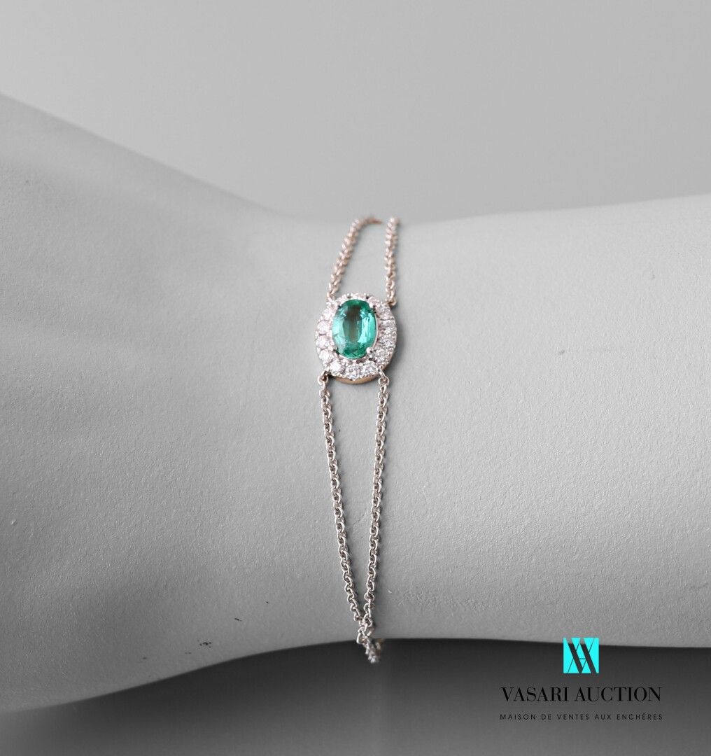 Null White gold bracelet with a V-shaped chain holding an oval emerald of about &hellip;