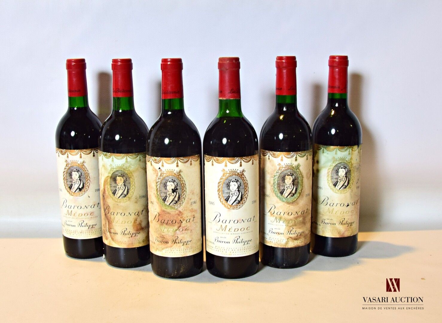 Null 6 bottles BARONAT Medoc 1986

	Et: 2 slightly stained, 4 stained. N: 2 mid/&hellip;