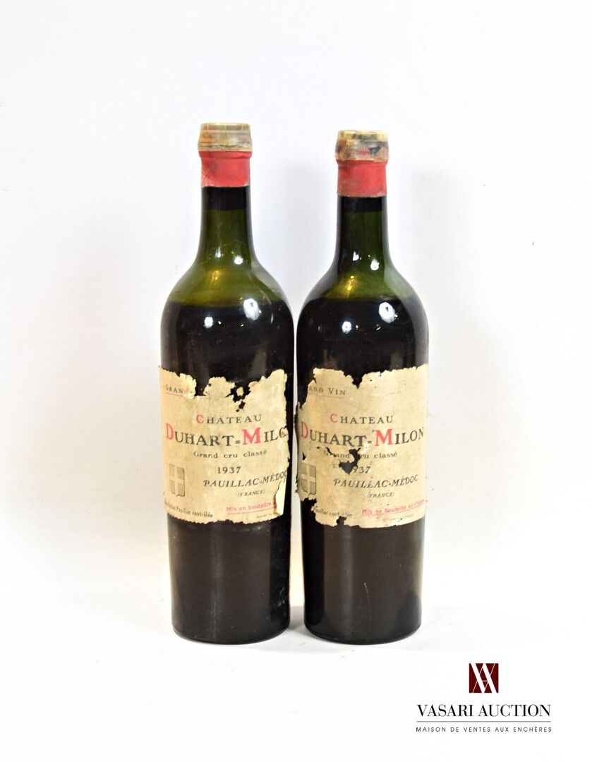 Null 2 botellas Château DUHART MILON Pauillac GCC 1937

	Y. Muy desgarrado. N: 1&hellip;