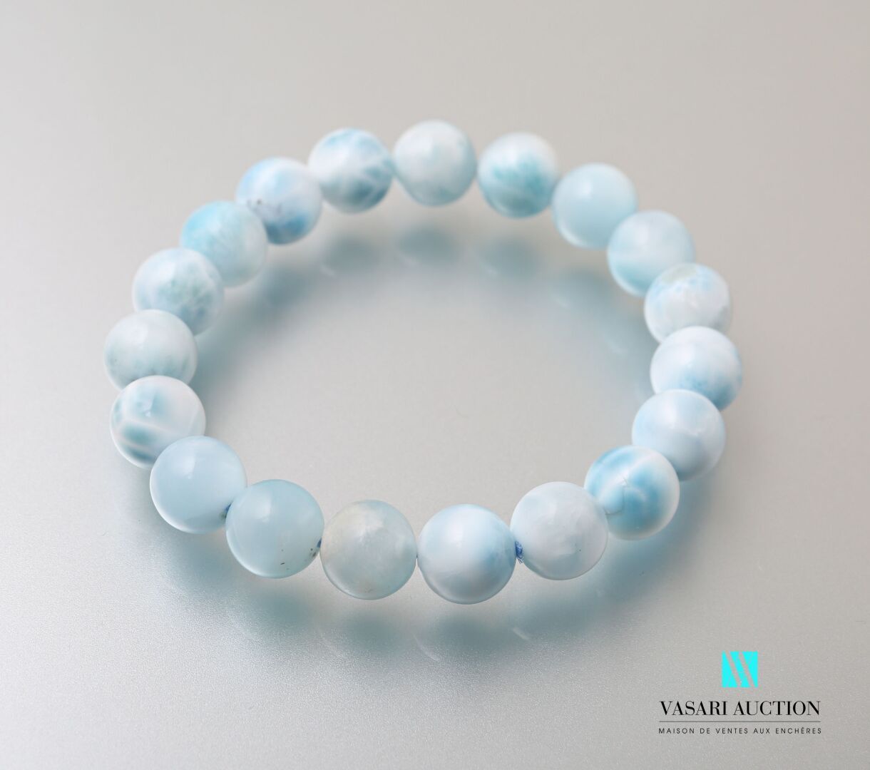 Null Bracelet decorated with larimar beads on elastic cord.