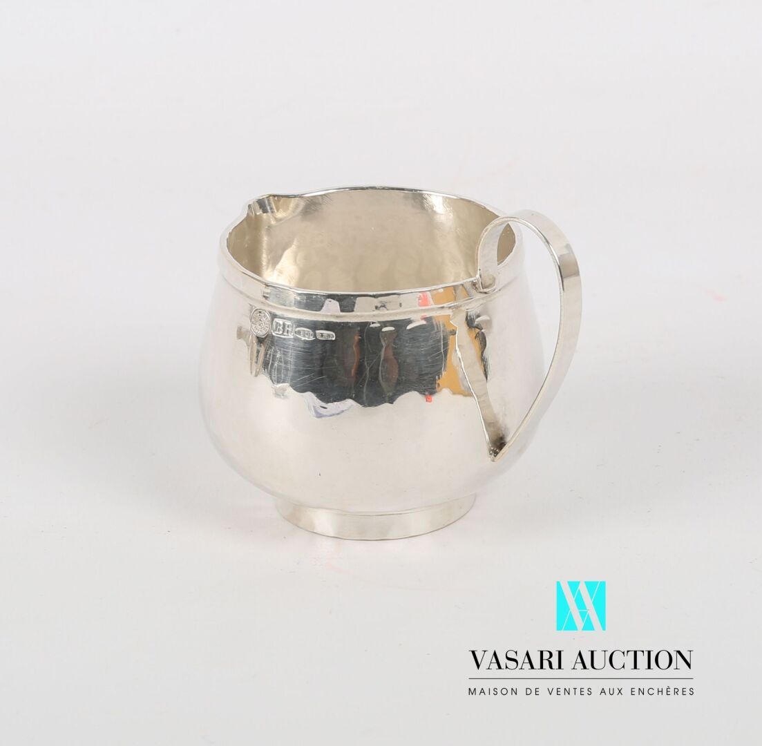 Null Milk pot in hammered silver 800 thousandths posing on a frame, the body pre&hellip;