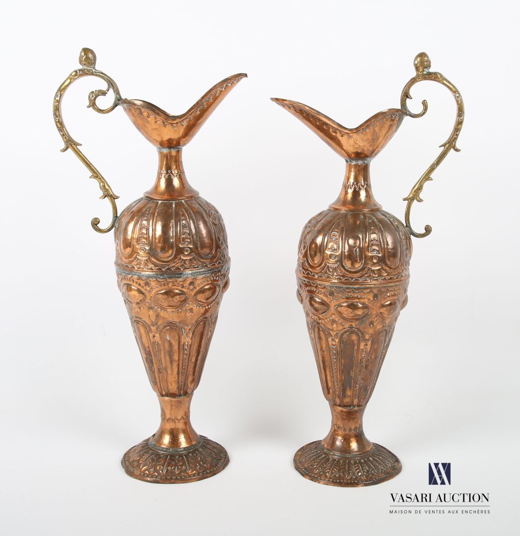 Null Two ewers in embossed copper, the body decorated with friezes of gadroons a&hellip;