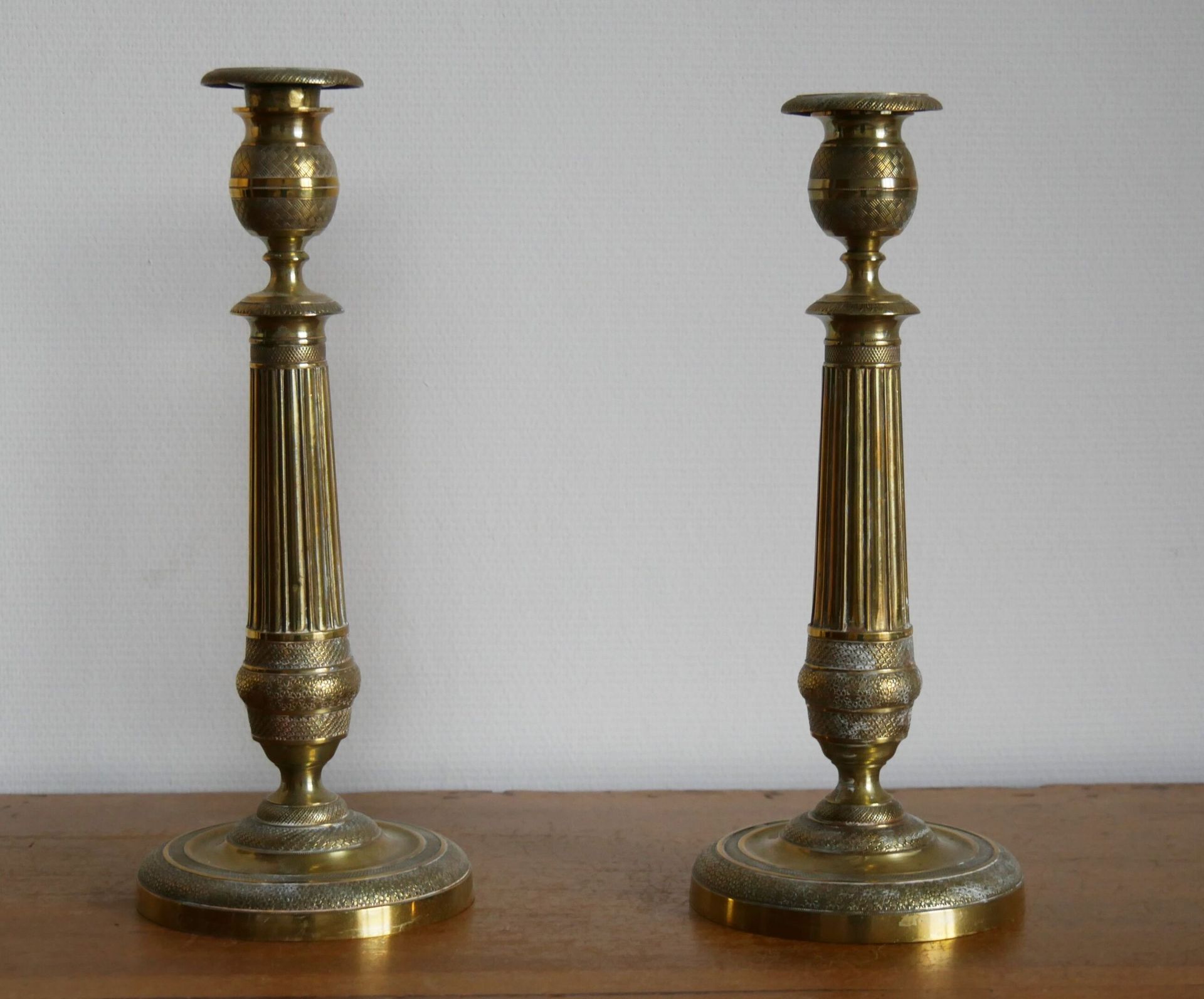 Null A pair of gilt brass torches with a baluster shaft resting on a circular ba&hellip;