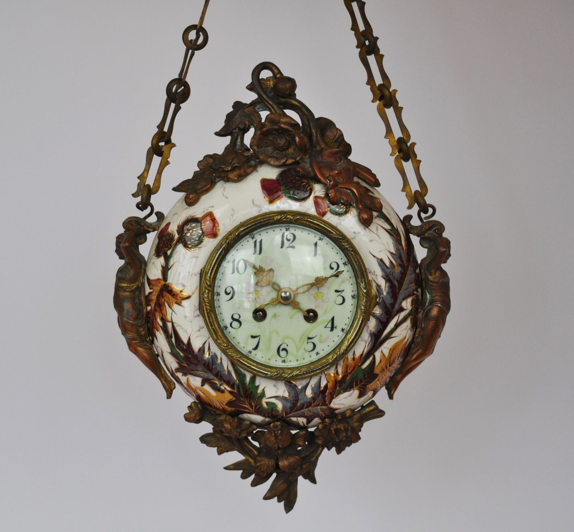 Null Suspended clock in white porcelain decorated with thistles, the movement is&hellip;