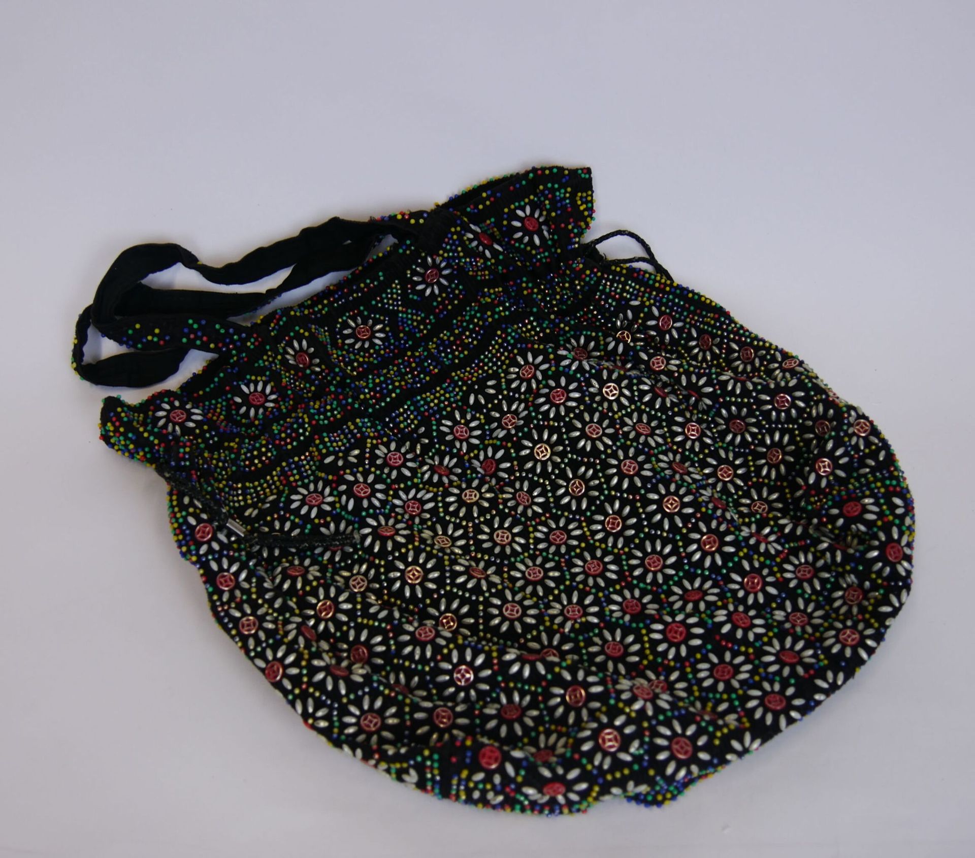 Null Black fabric shoulder bag with multicolor beaded decoration. Circa 1970. 

&hellip;