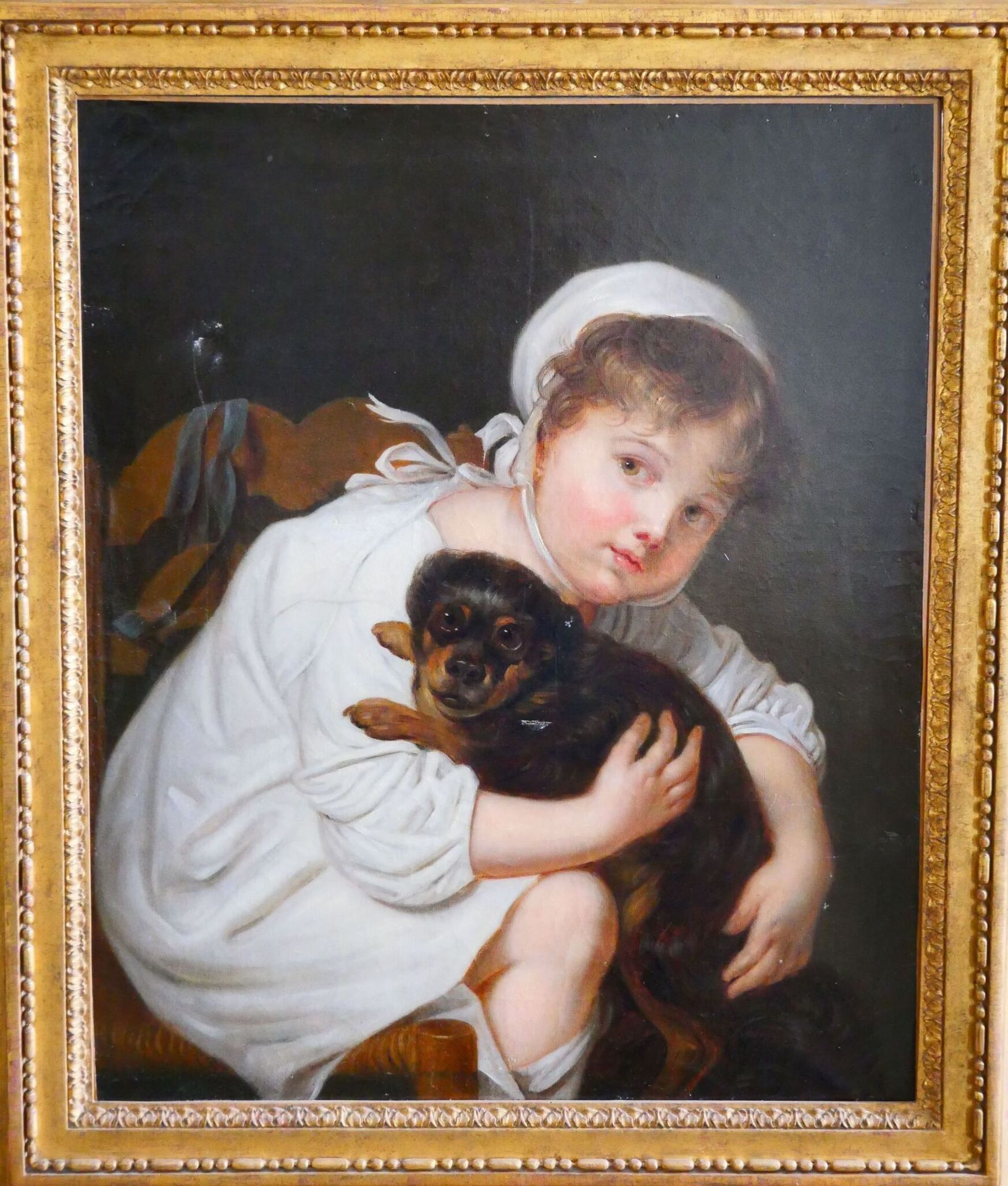 Null D'après Jean-Baptiste GREUZE (1725-1805) 
Jeune fille au chien 
Huile sur t&hellip;