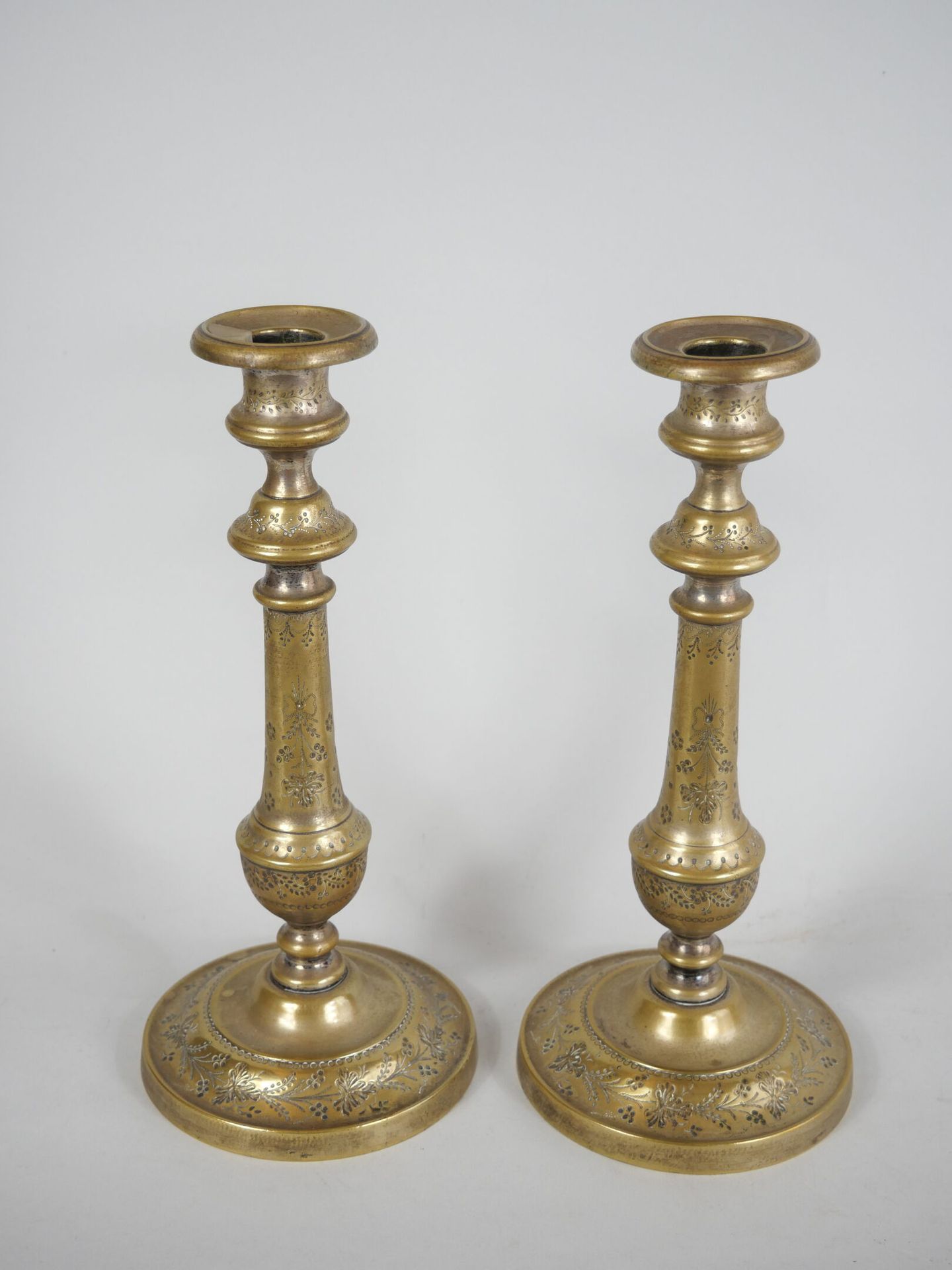 Null Pair of gilded brass torches, the baluster shaft engraved with flowers, res&hellip;