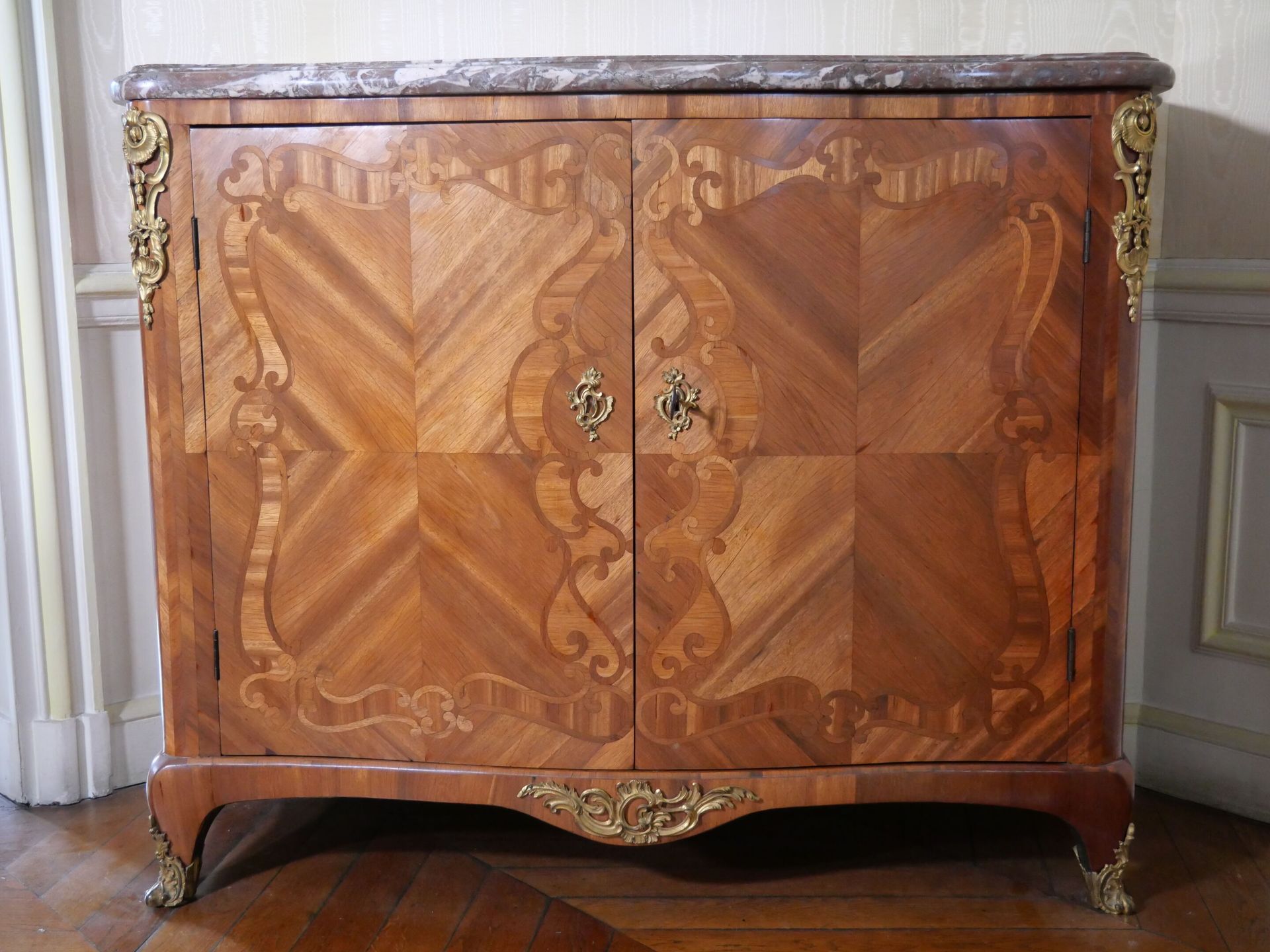 Null Chest of drawers with scrolled doors opening on two wide leaves, decorated &hellip;