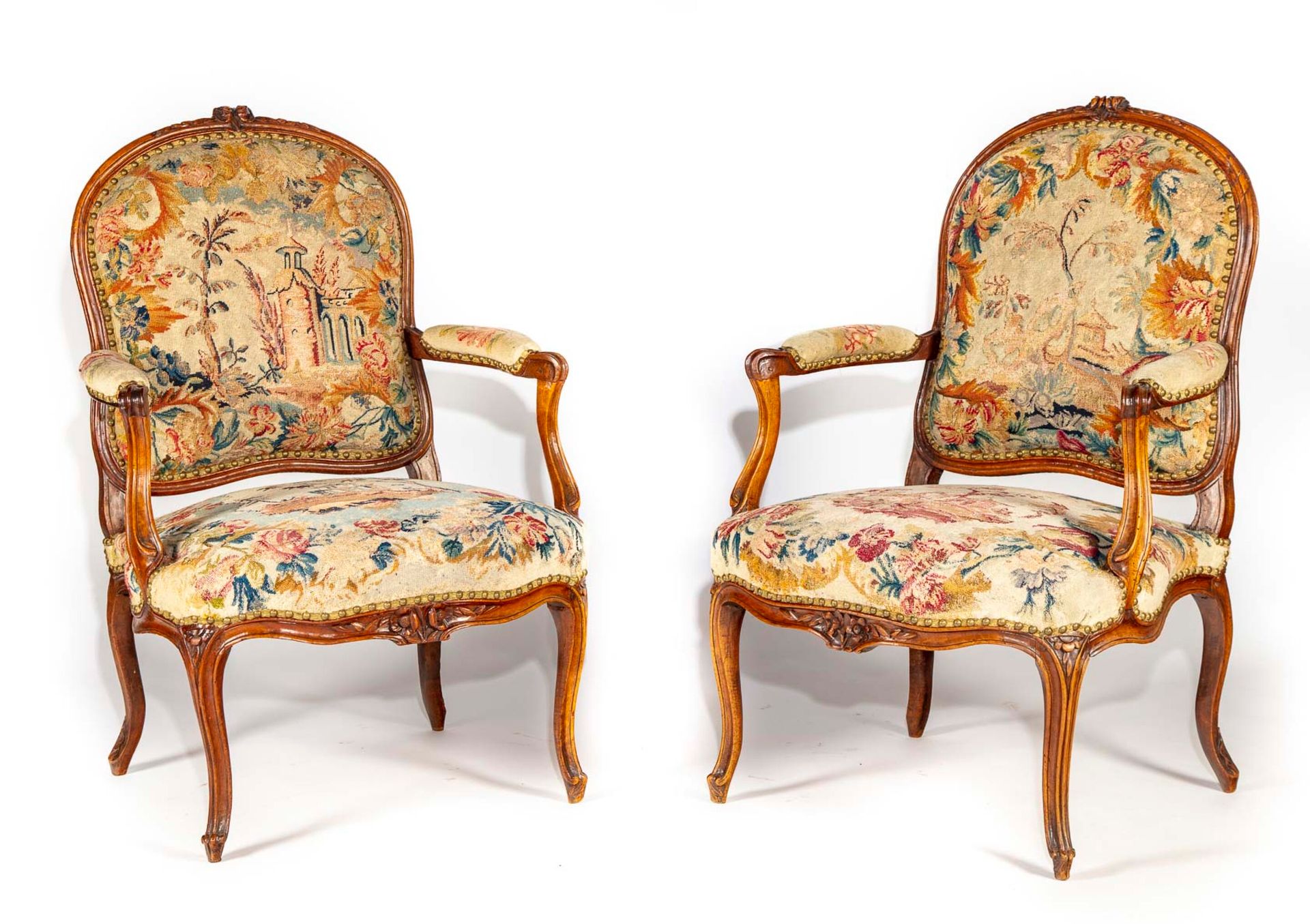 Null Pair of walnut and stained beech armchairs, moulded and carved, with flat r&hellip;