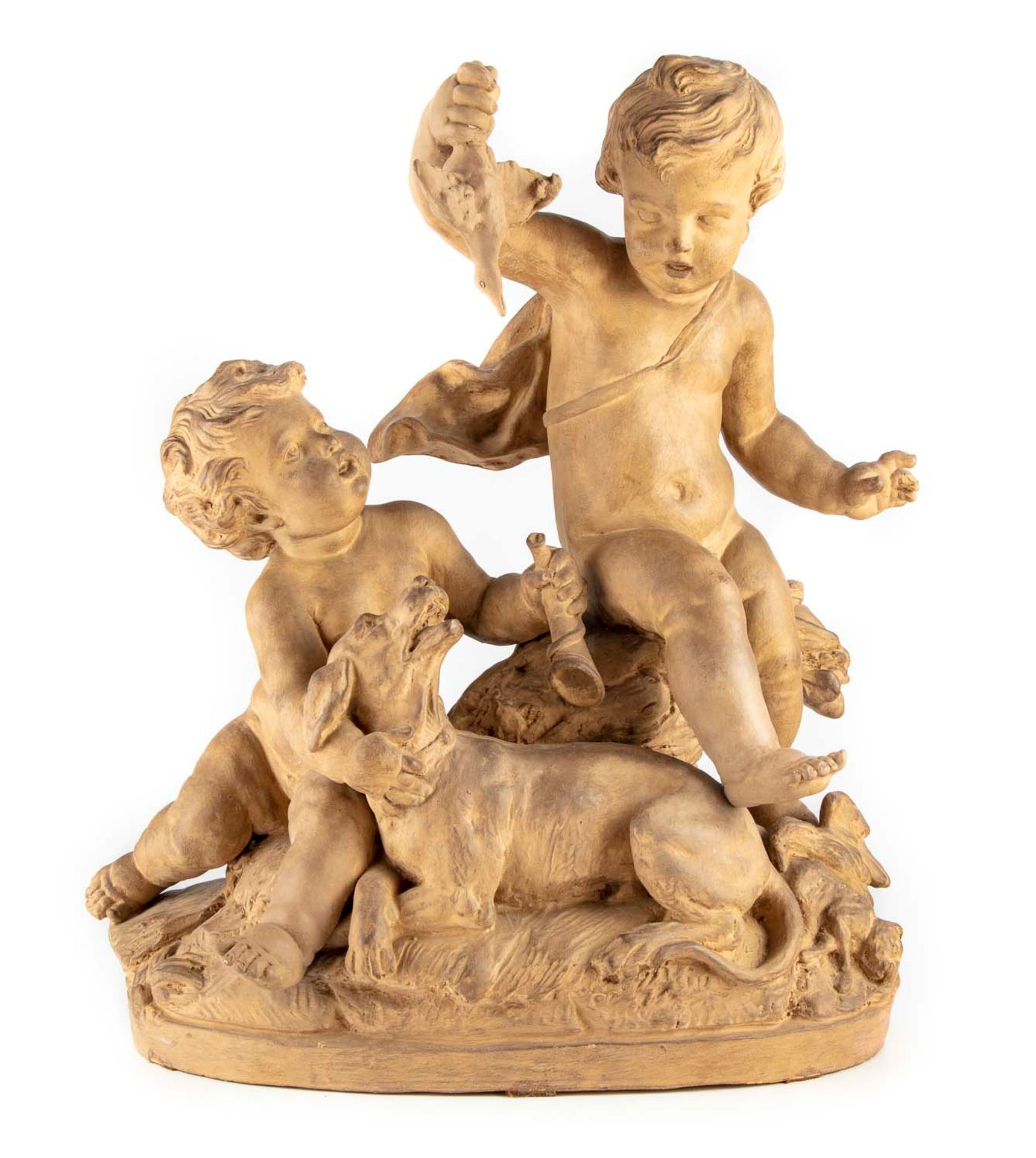 Null A terracotta group of children playing with a dog; signed on the reverse pr&hellip;