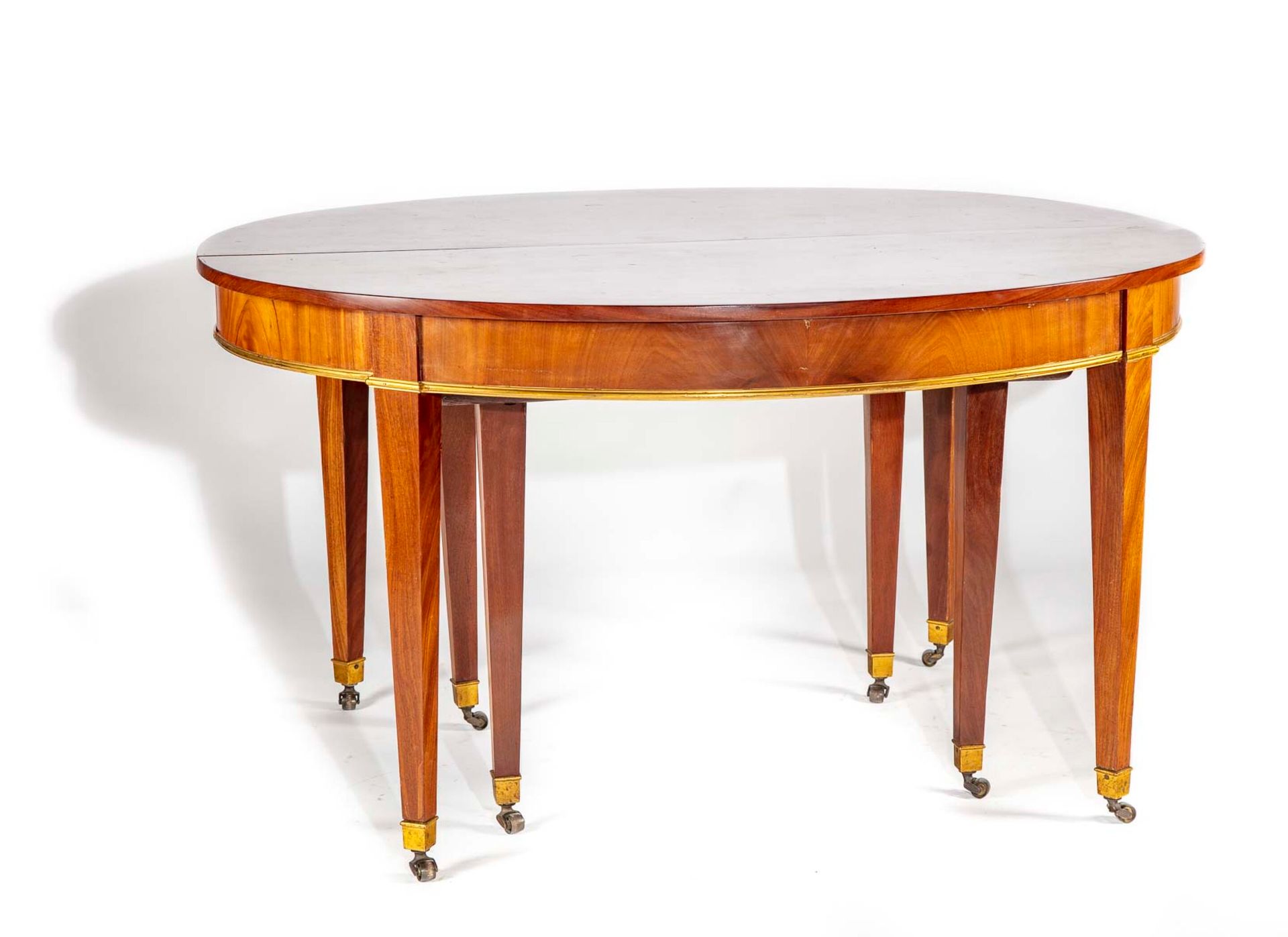 Null Mahogany dining room table, oval shape, resting on sheath legs with casters&hellip;