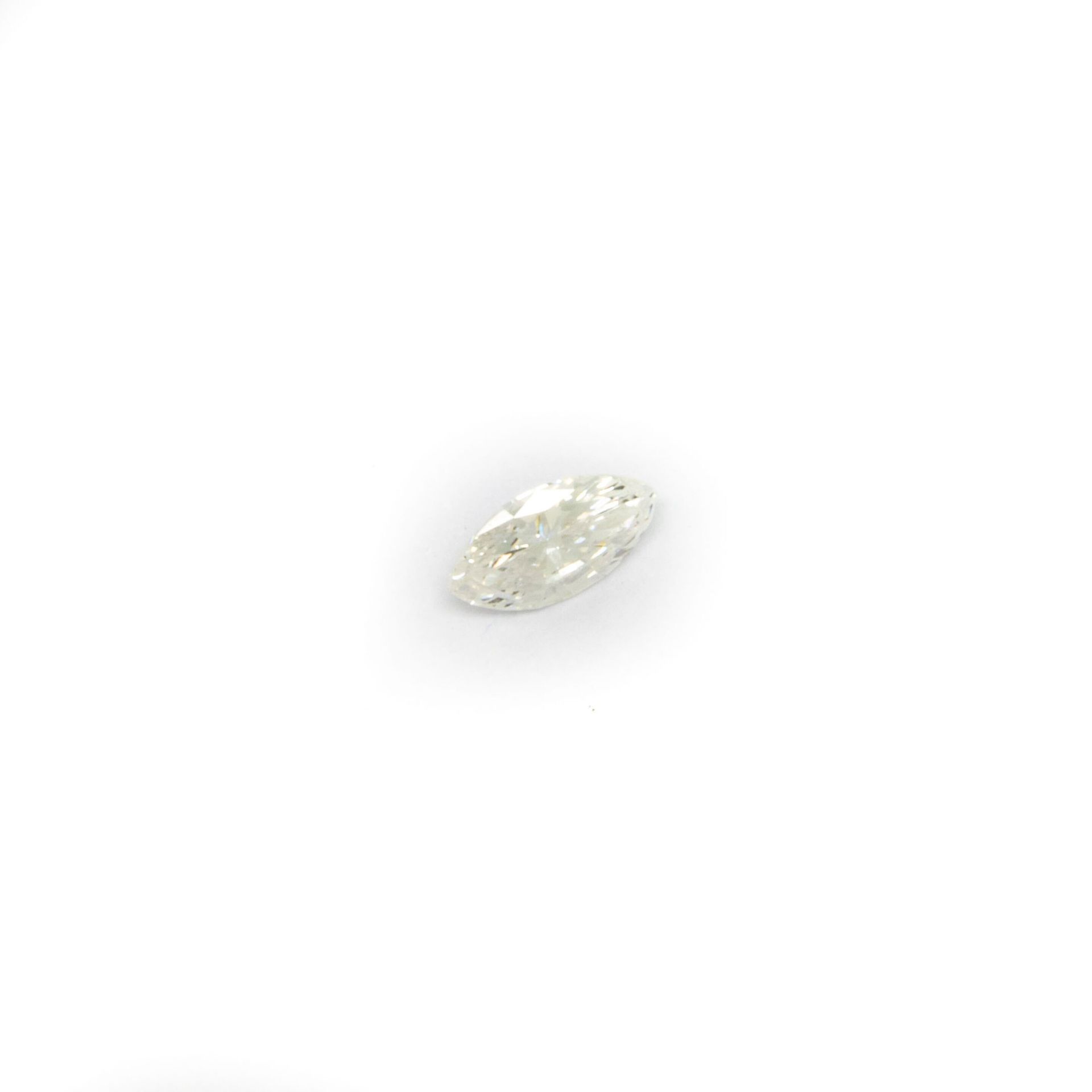 Null Shuttle diamond on paper, weighing 0.5 ct.