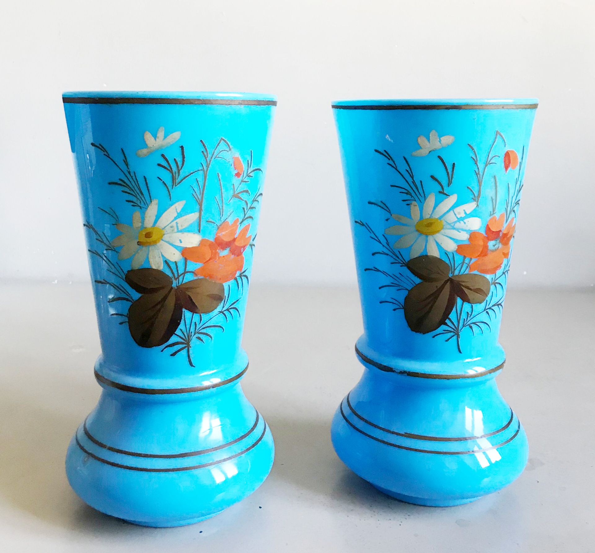 Null A pair of large opaline glass vases with polychrome decoration of flowers. &hellip;