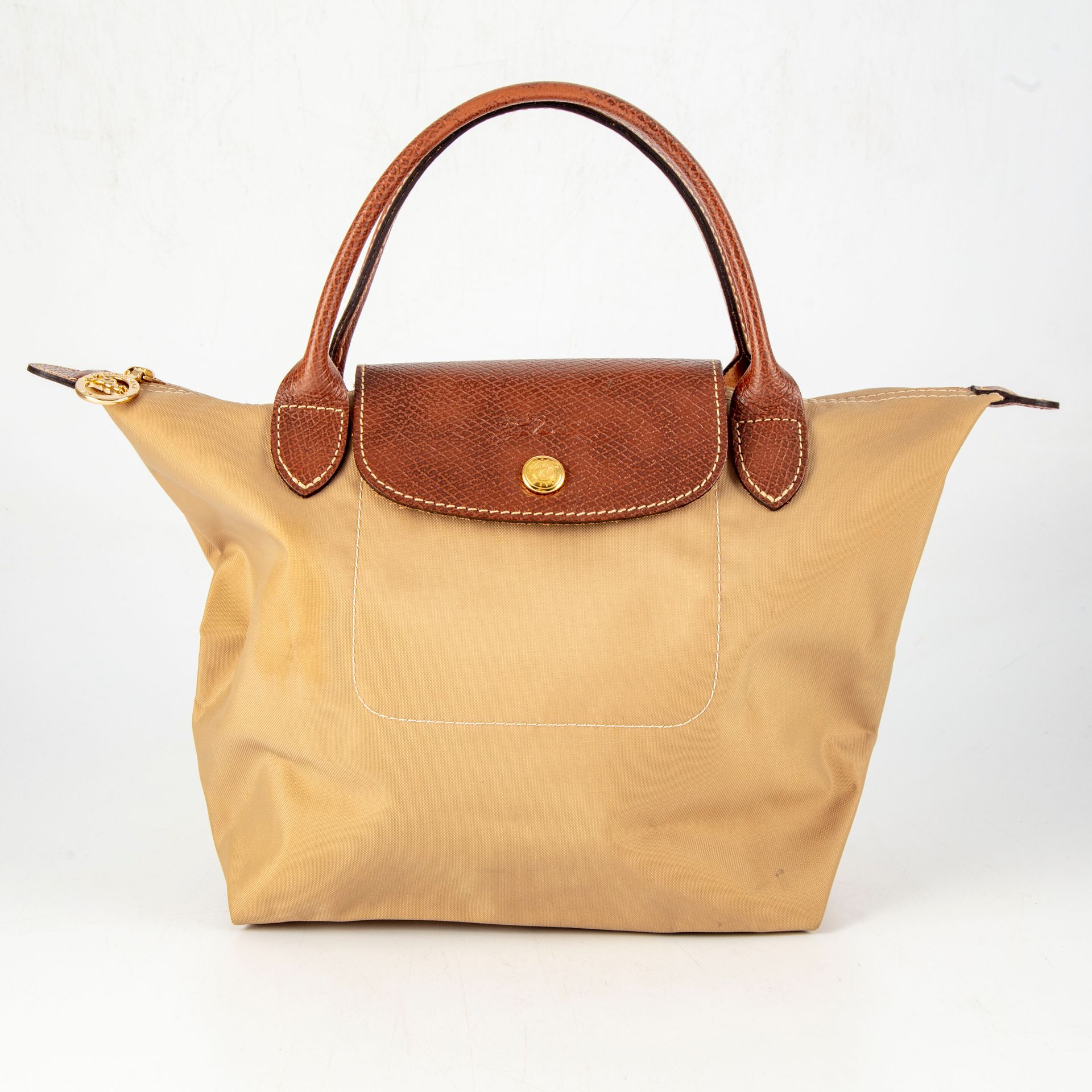 Null LONGCHAMP

Handbag in waxed canvas and leather handles. 

L. : 30 cm