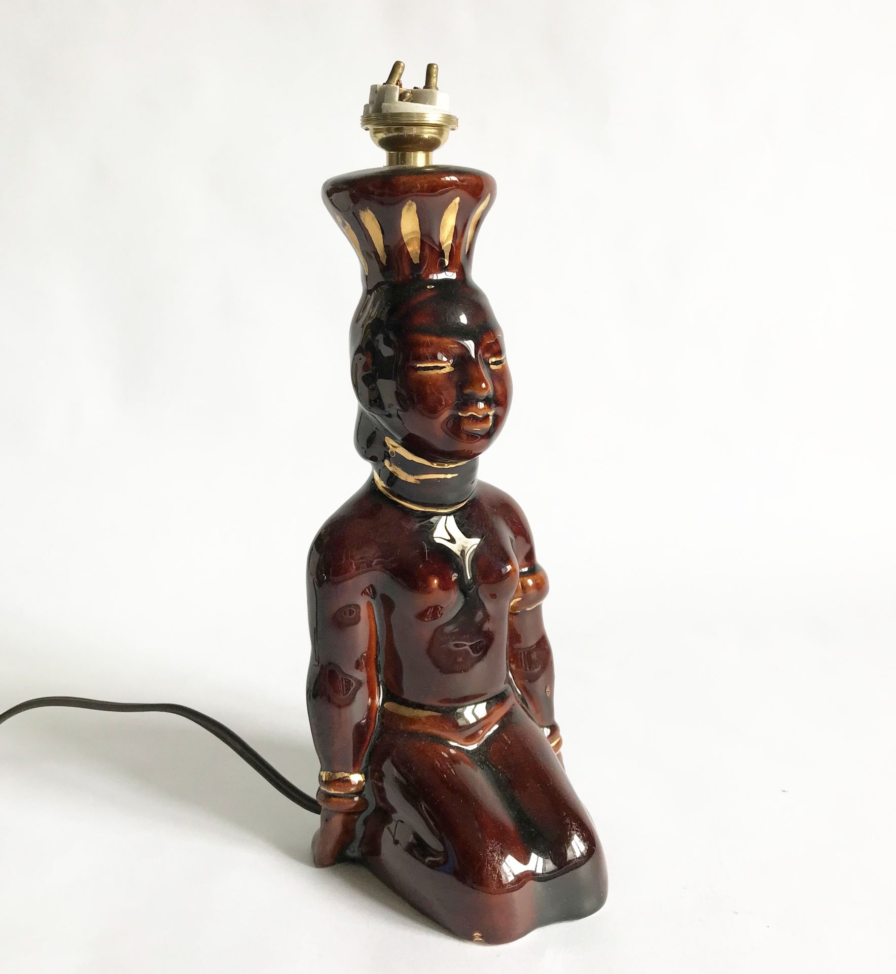 Null Small antropomorphic lamp in brown and gilded enamelled earthenware.

H. 20&hellip;