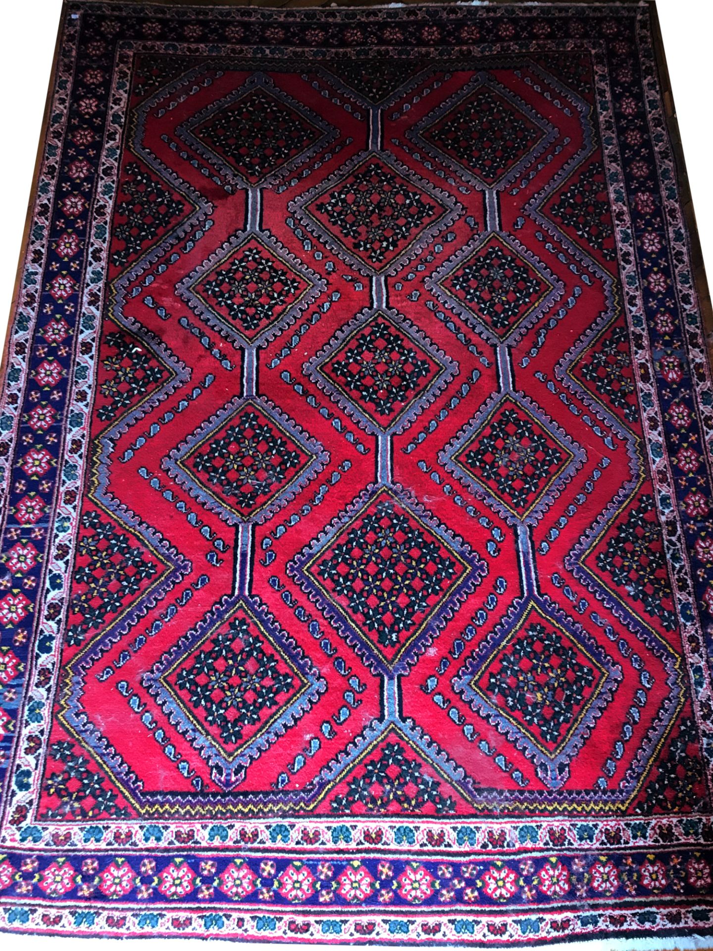 Null PERSAN carpet with geometric medallions and garlands of boteh on red field.&hellip;