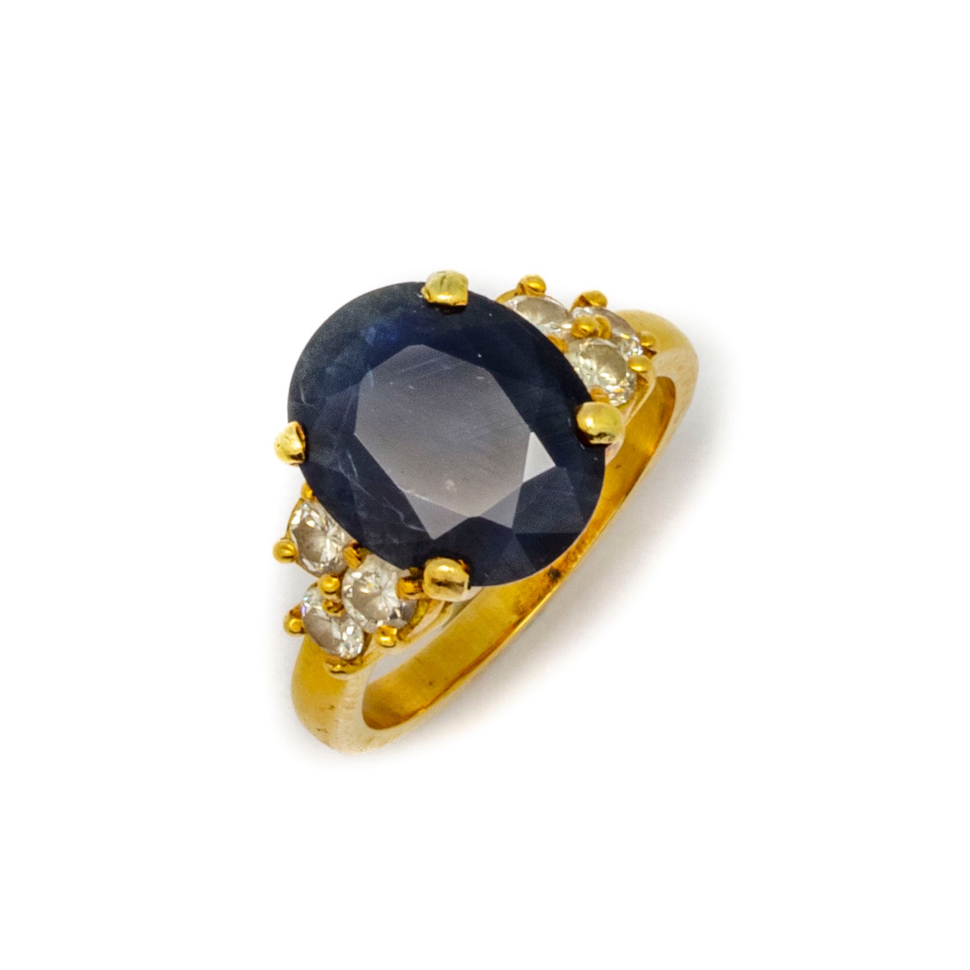 Null 18K yellow gold ring set with an oval sapphire and six small diamonds
TDD :&hellip;