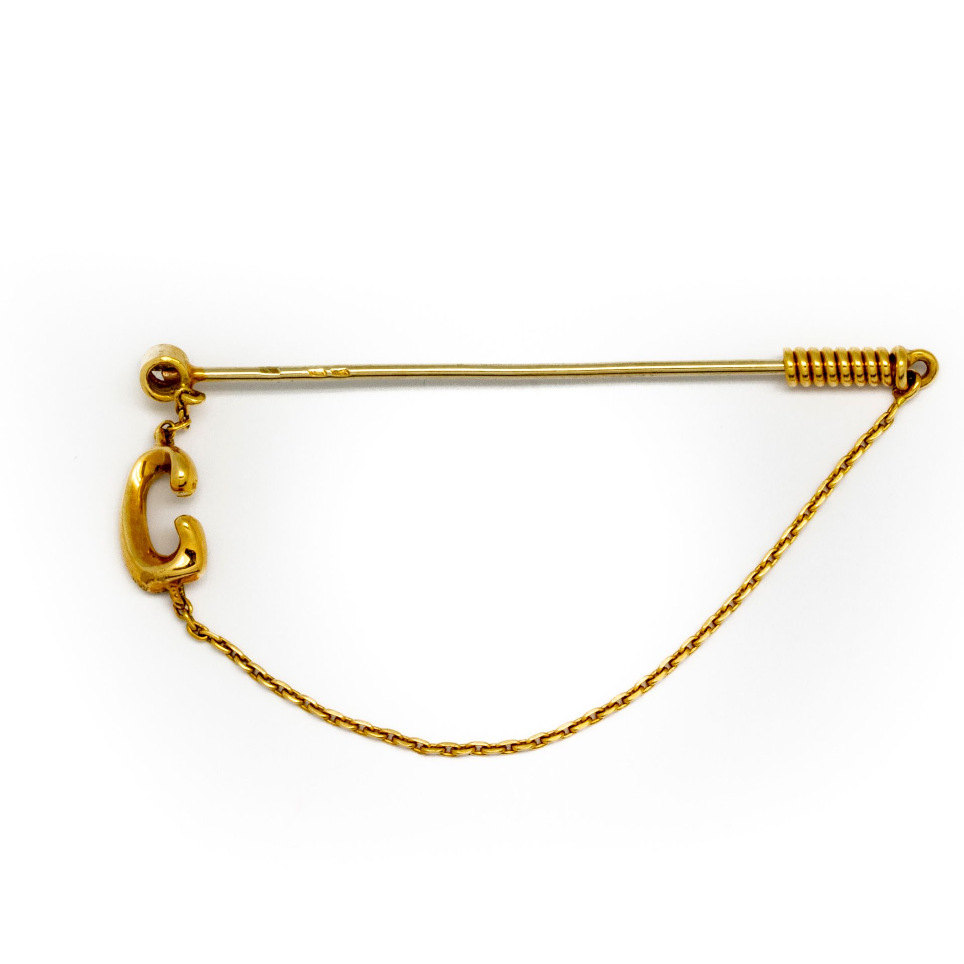 Null Tie pin in yellow gold with a small brilliant 
Gross weight : 1,7 g