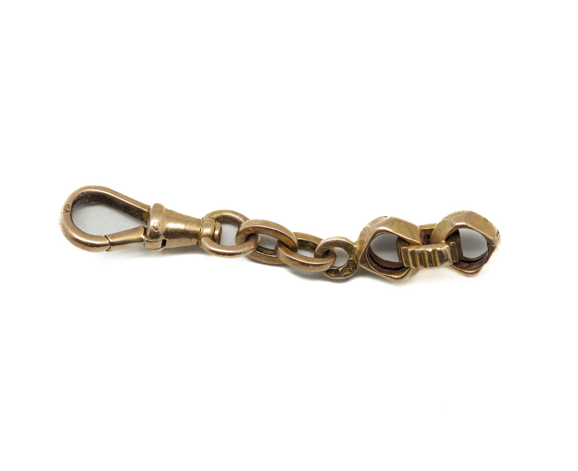 Null Element of gold watch chain.
Weight : 2,7 g.