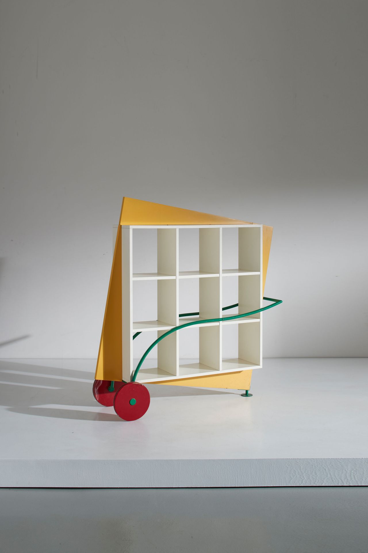 Manifattura Italiana Bookcase. Lacquered wood, enameled iron. Italy 1980s
cm 139&hellip;