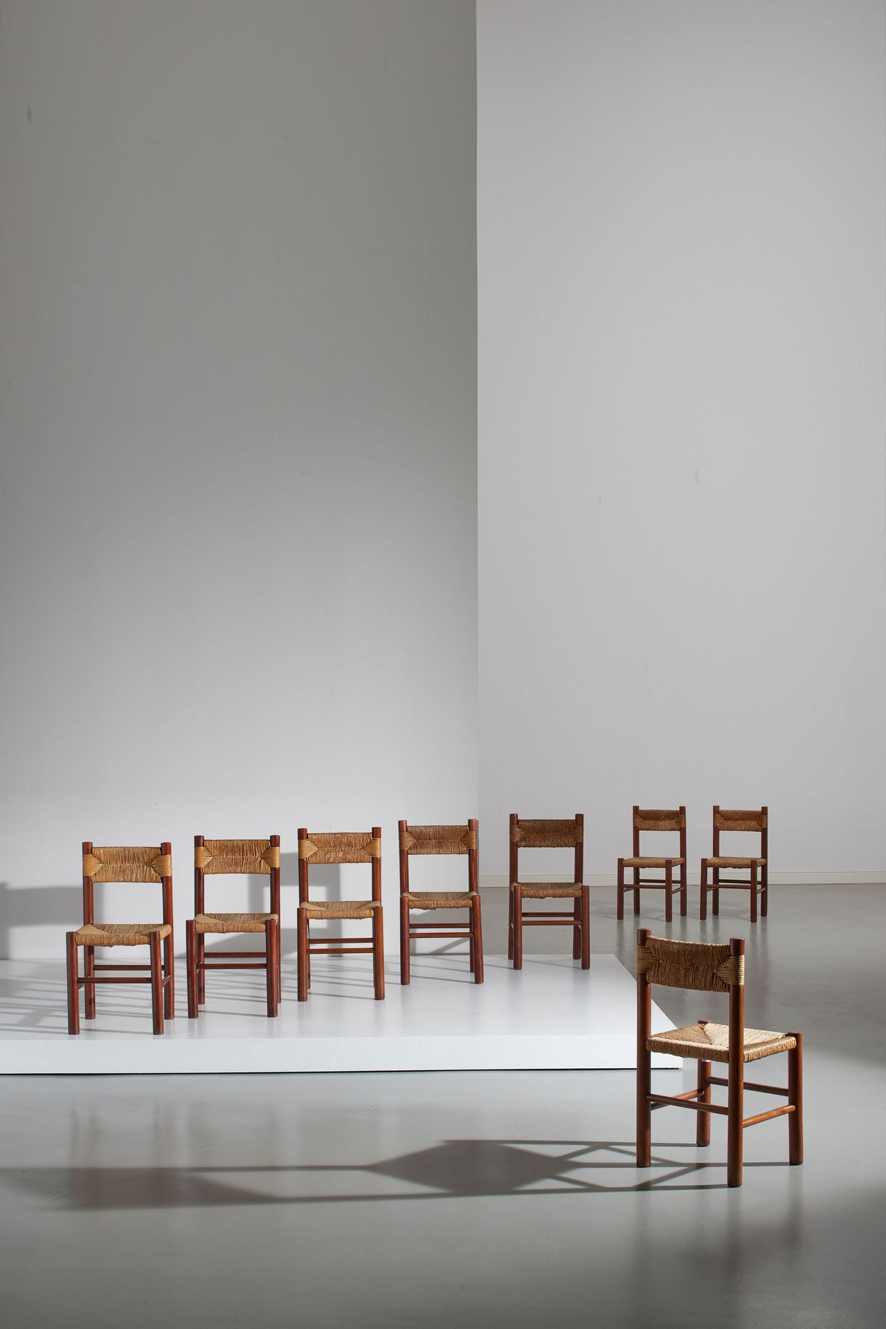 CHARLOTTE PERRIAND (ATTRIB. A) Eight chairs. Turned beech wood, woven river stra&hellip;