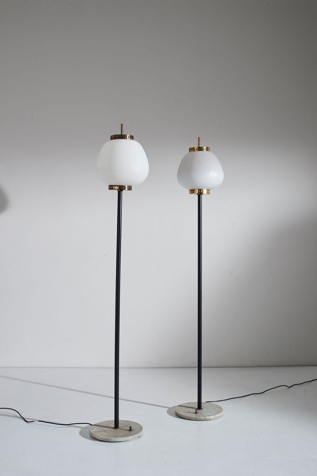 STILNOVO Pair of floor lamps. Marble, painted metal, brass, frosted opaline glas&hellip;