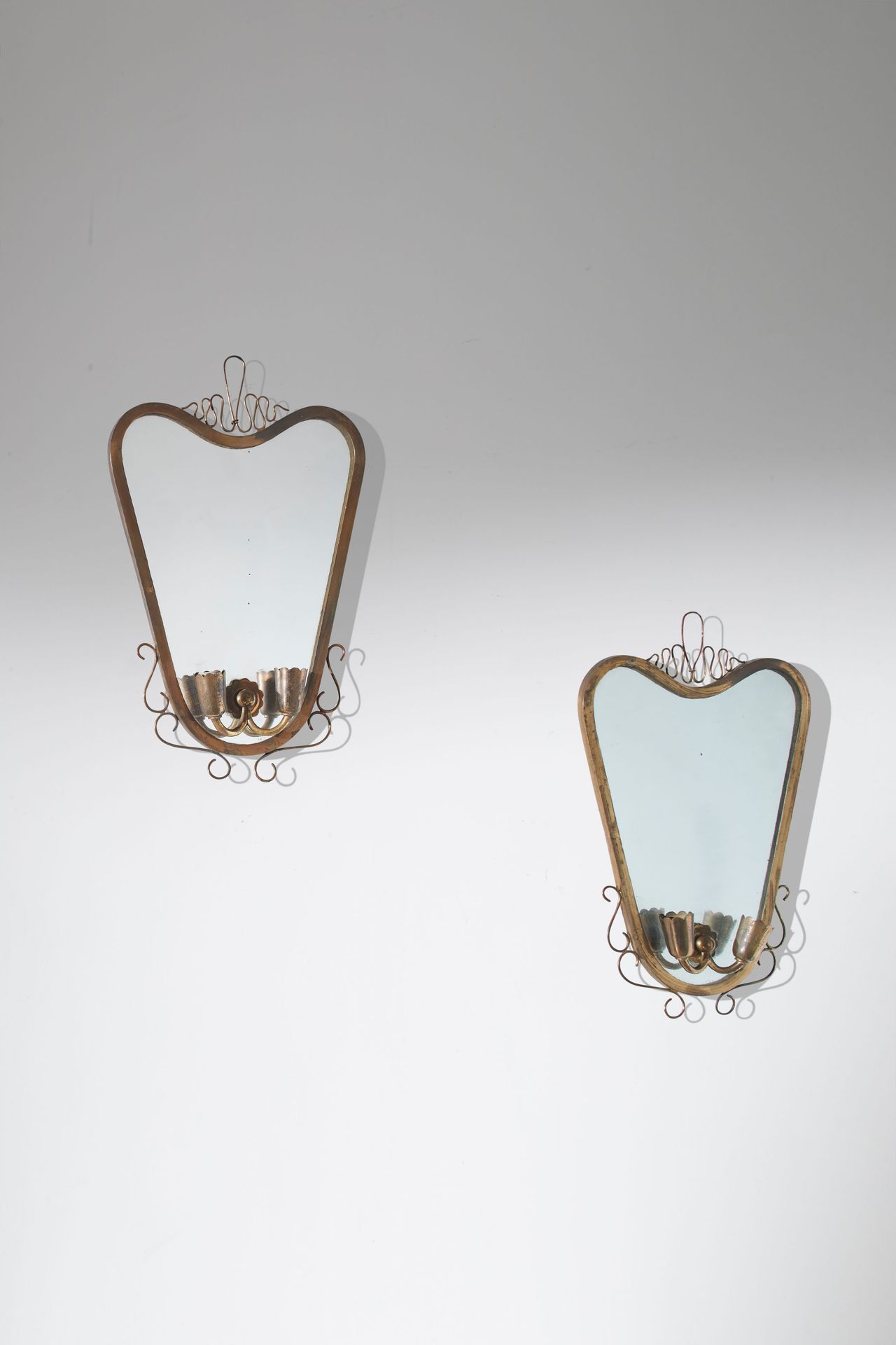 Manifattura Italiana Two wall sconces. Brass, mirrored glass. Italy 1950s.
Cm 42&hellip;