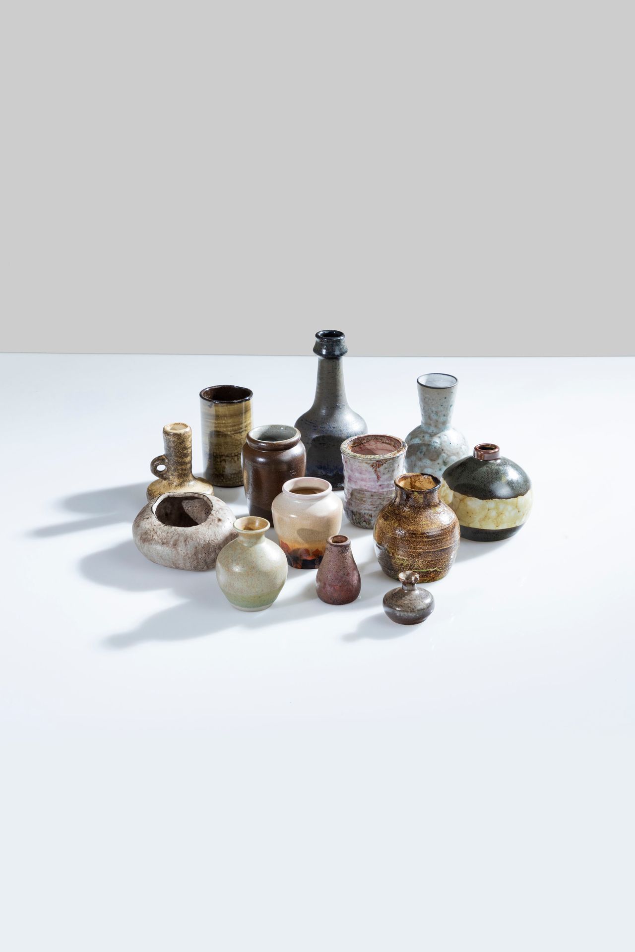 MANIFATTURA ITALIANA Ten polychrome ceramic objects. 1960s. 
Maximum height 16 c&hellip;