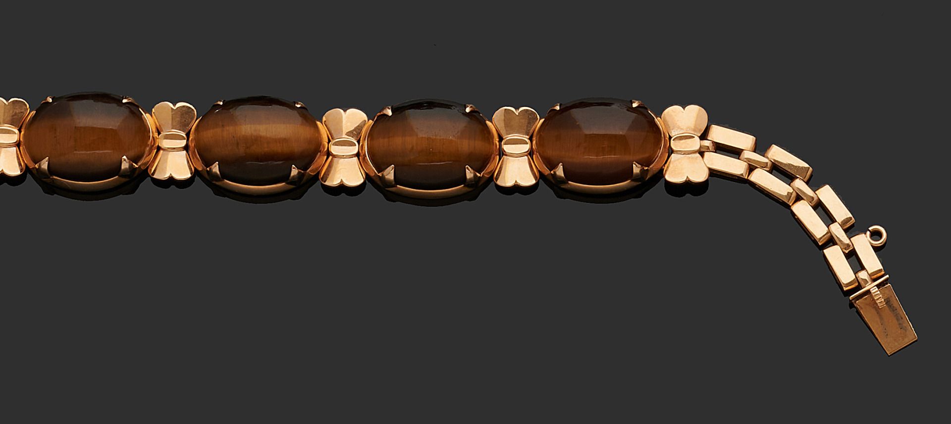 Null Gliederarmband aus 750er Gelbgold, das in der Mitte mit vier Tigeraugenquar&hellip;