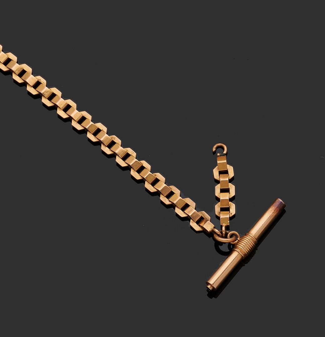 Null 黄金七十五万分之一的链式钱包，末端有一把黄金七十五万分之一的手表钥匙和金属。
(穿)。
长度： 21 cm
毛重 : 28,9 g