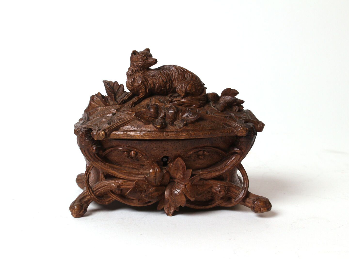 Null Small carved wooden box decorated with a fox lying down and leafy branches.&hellip;