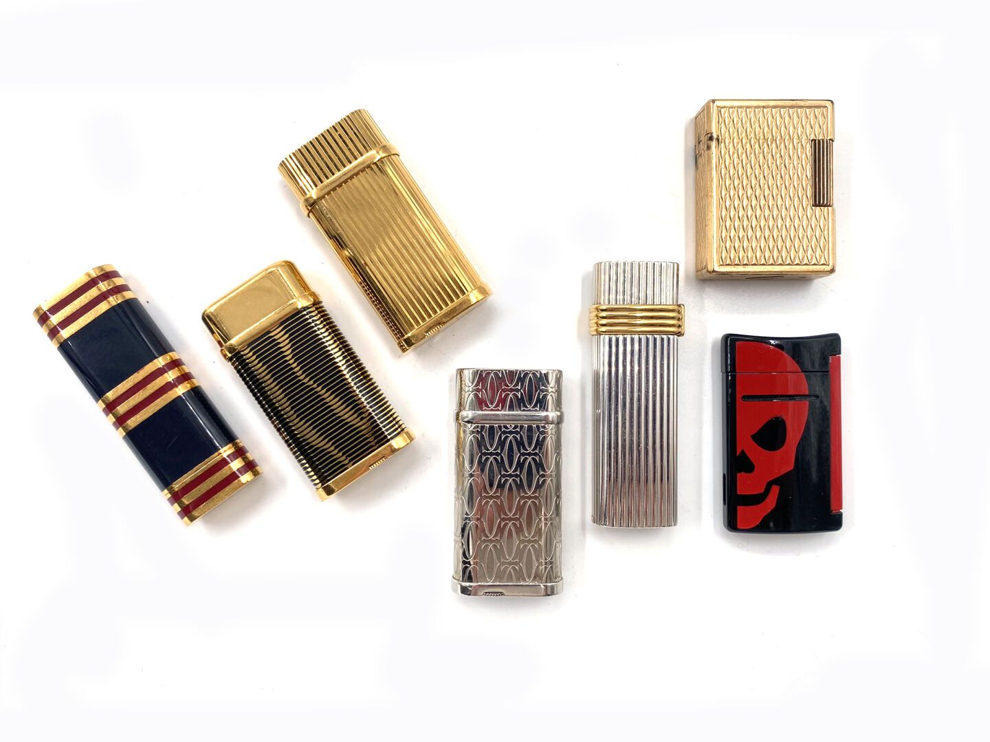 Null SET of seven lighters in metal or gilded metal, 
CARTIER for four (signed),&hellip;