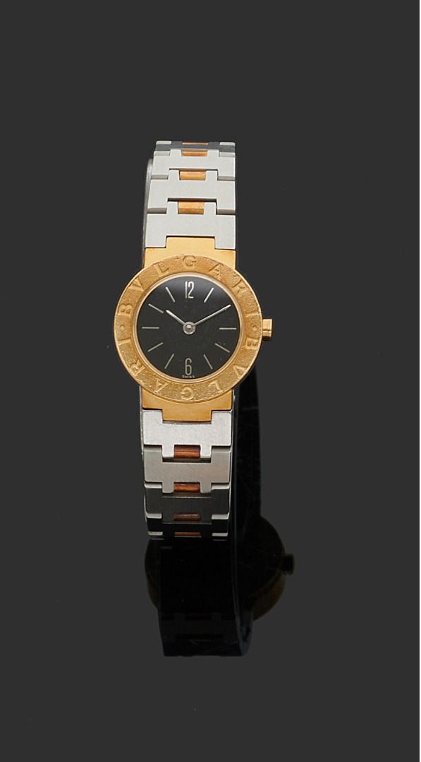 Null BULGARI 
Ref. 5116
No. A 5015
Steel and 18k (750) gold wristwatch. Round ca&hellip;