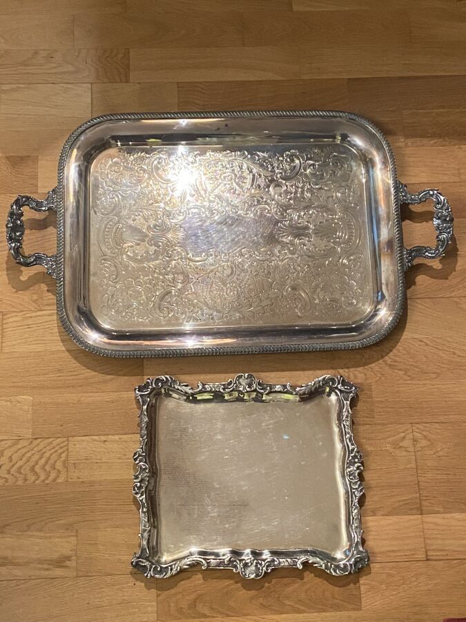 Null Two rectangular trays in silver plated metal:
one decorated with shells and&hellip;