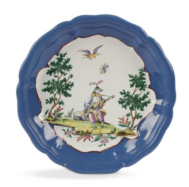 Null Milan
Plat rond en faïence décor polychrome au centre d'un Chinois jouant d&hellip;