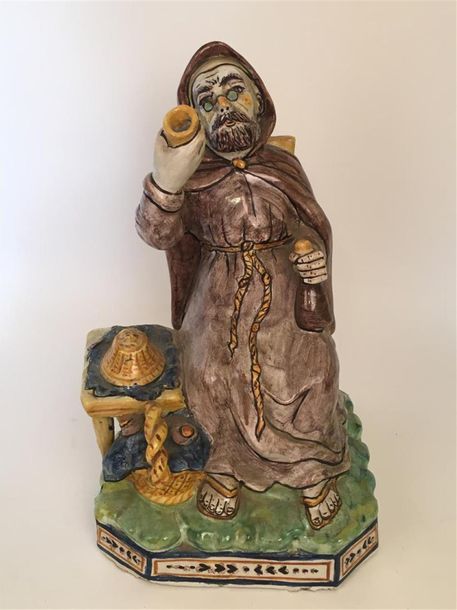 Null Nevers
Figure représentant un moine assis tenant un gobelet et une bouteill&hellip;