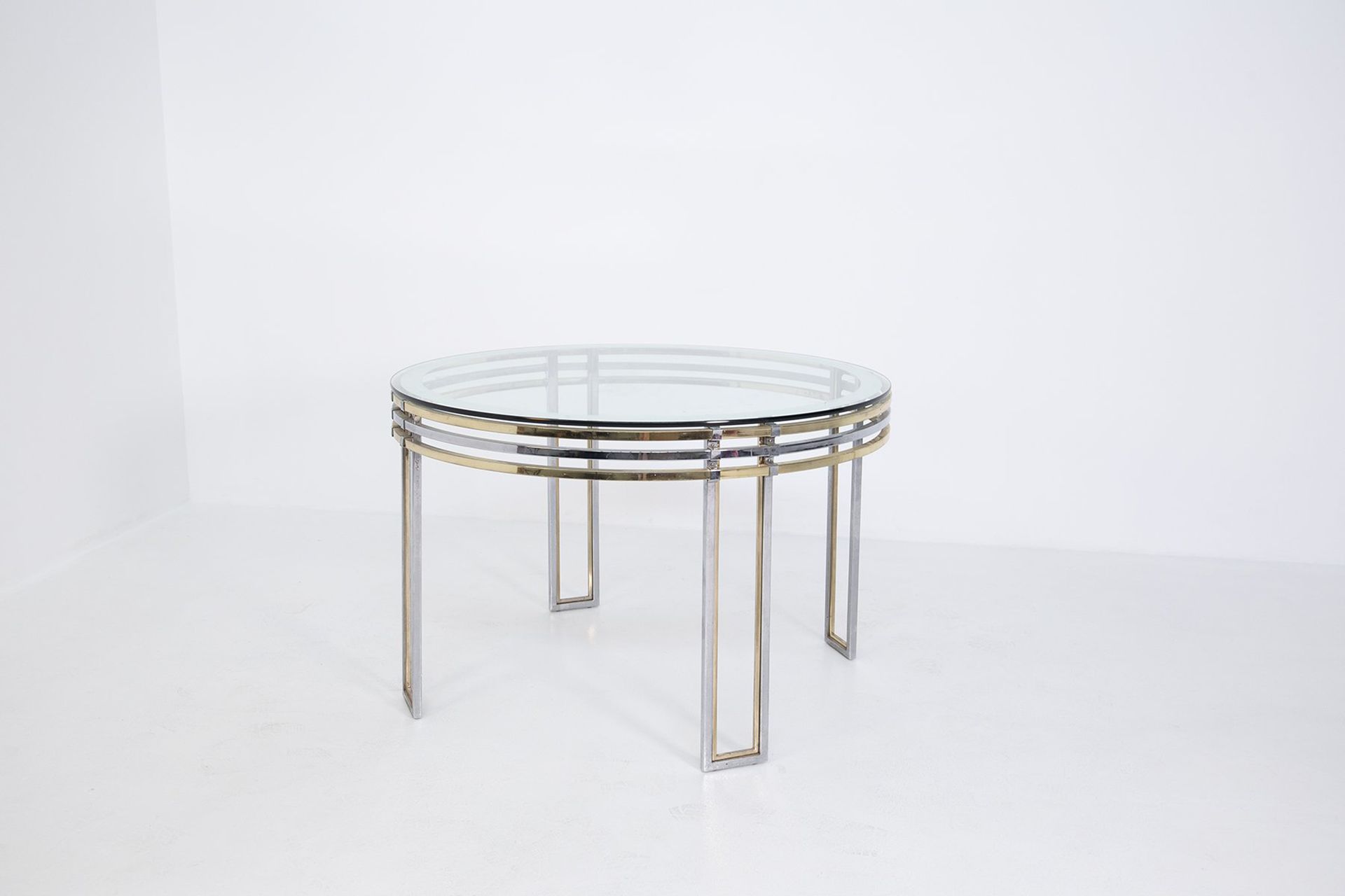 ROMEO REGA. Table in brass, steel and glass ROMEO REGA (Rom, 1904-1968). Runder &hellip;
