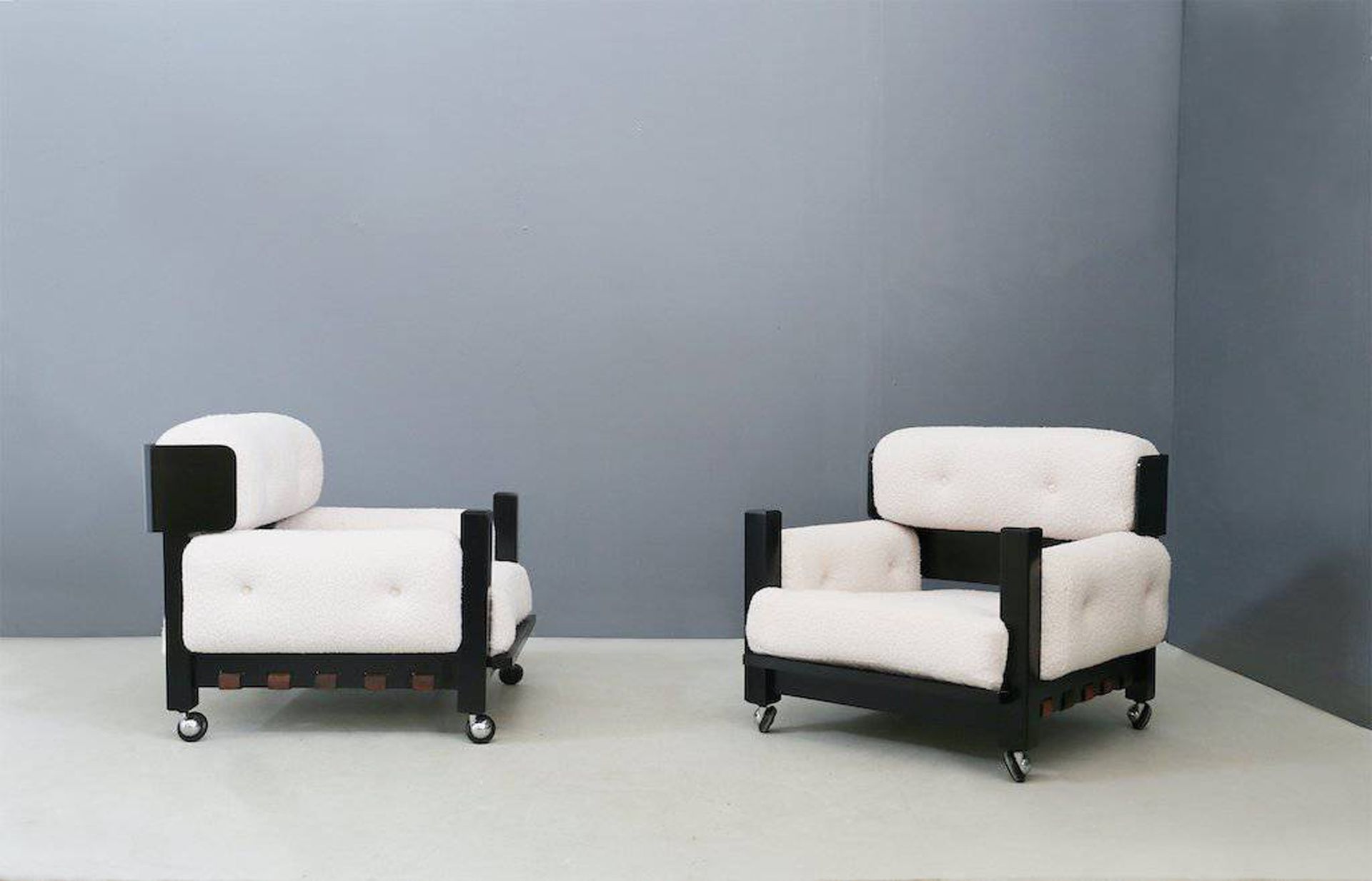 Two wooden armchairs. Italy. 1960s Coppia di poltrone in legno e tessuto bouclé.&hellip;