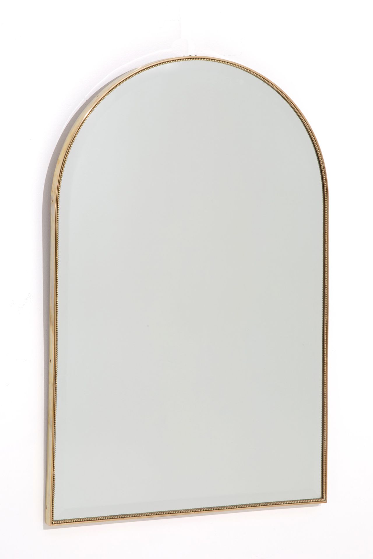 MIRROR Miroir semi-ovale en laiton. 1950s. 90x60 cm ca.