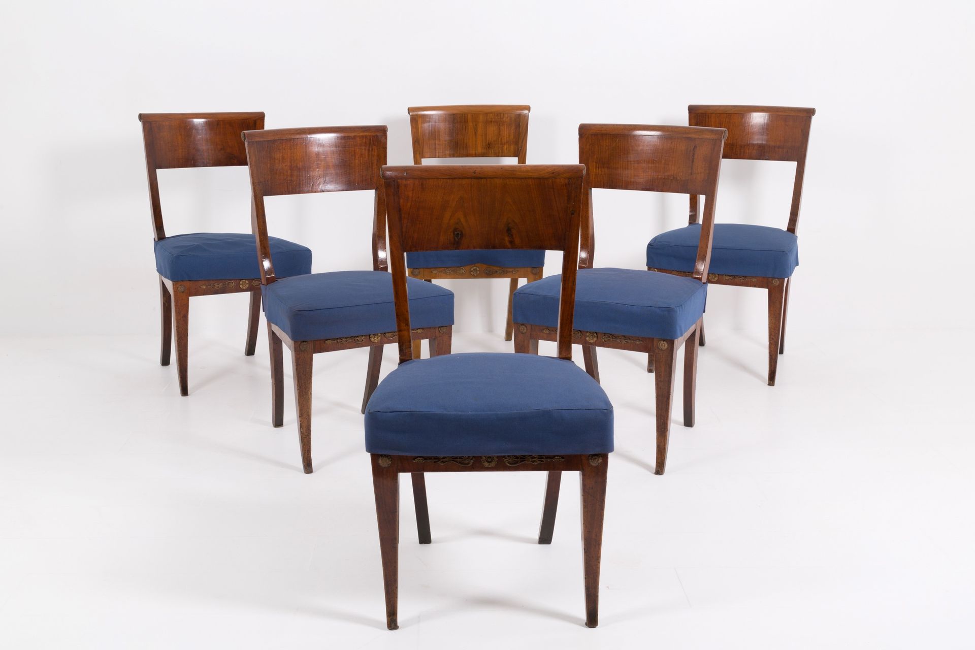 Six walnut chairs Six walnut chairs with gilt bronze friezes on the folder and s&hellip;
