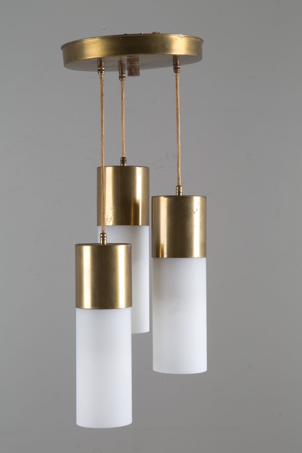 Three cylinder chandelier 三灯黄铜吊灯，配牛奶玻璃圆柱。1970s.约 68x25 厘米