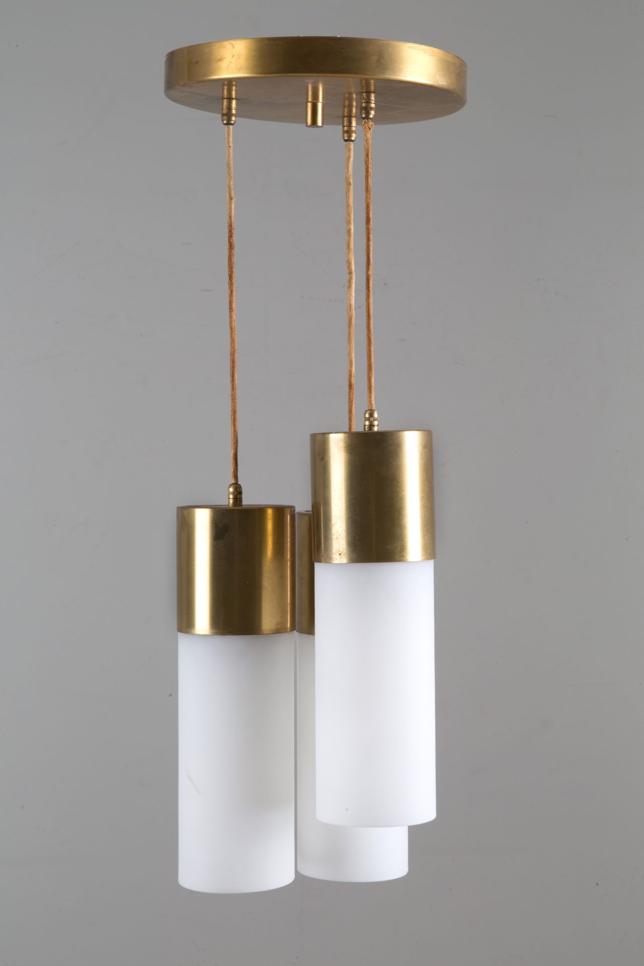 Three cylinder chandelier 三灯黄铜吊灯，配牛奶玻璃圆柱。1970s.约 68x25.5 厘米