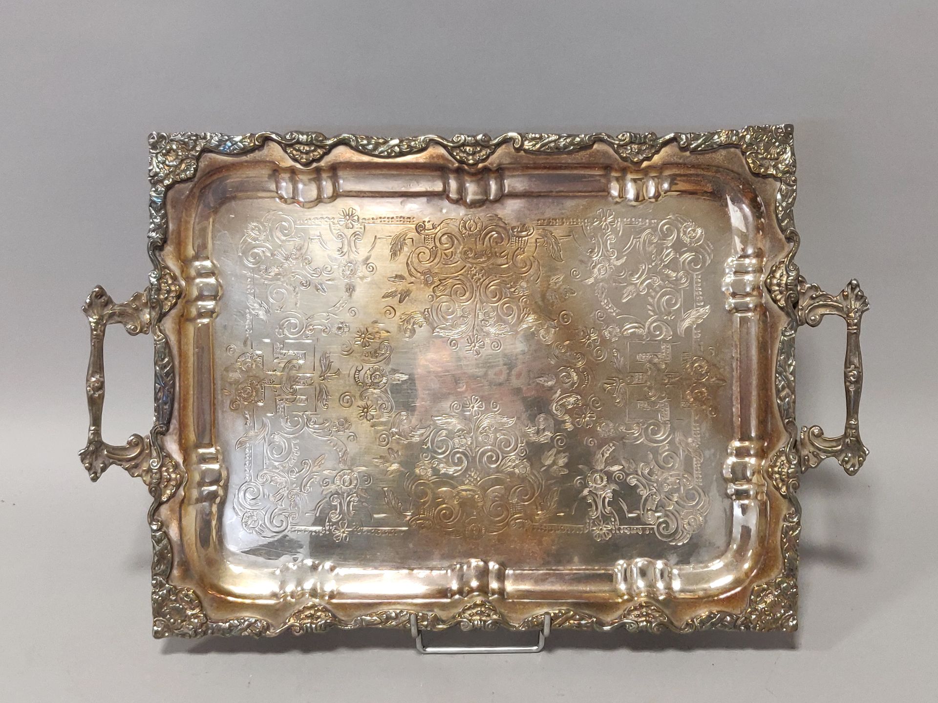 Null A rectangular silver platter with two handles, engraved and chased with scr&hellip;
