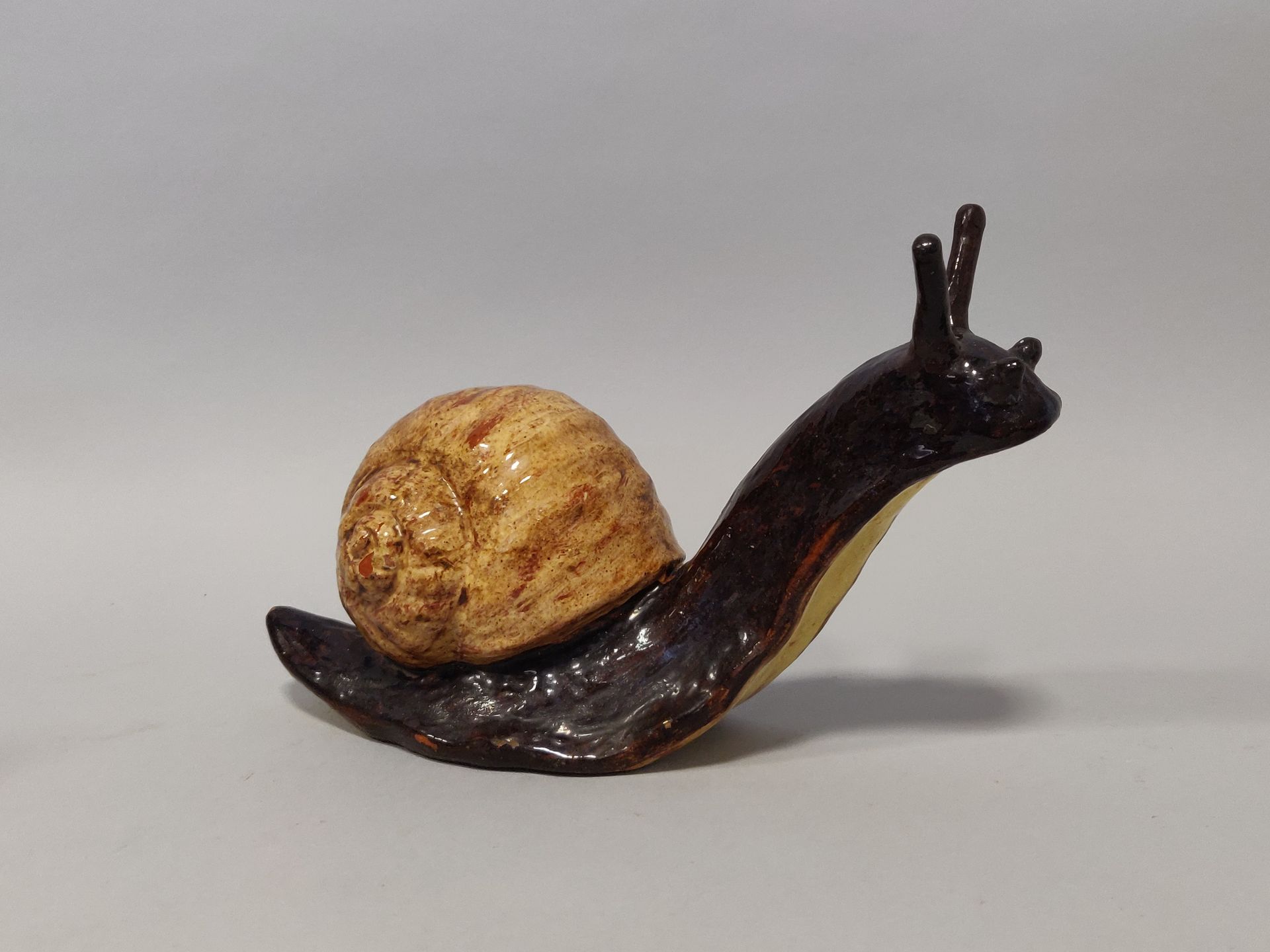 Null BAVENT. Polychrome glazed terracotta subject representing a snail. Height: &hellip;