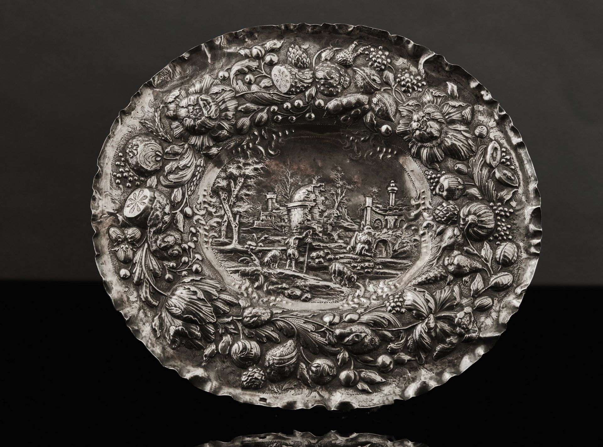 Null A silver dish with an embossed and engraved background with a shepherd and &hellip;
