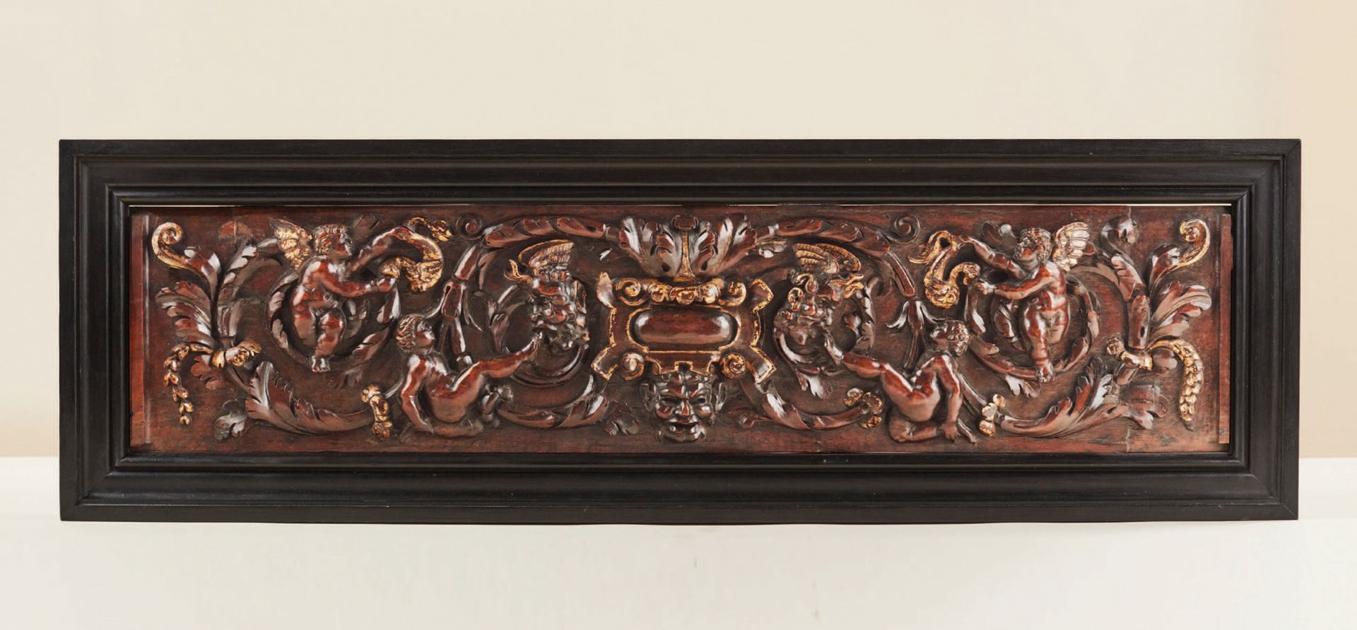 Null Cassone panel in walnut carved in high relief with gilding. In the center, &hellip;